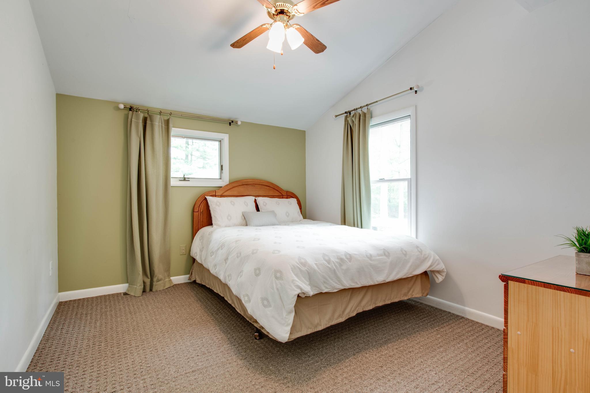 5519 Woodbine Road Sykesville, MD 21784 - Photo 32 of 69 a bedroom with a bed and window