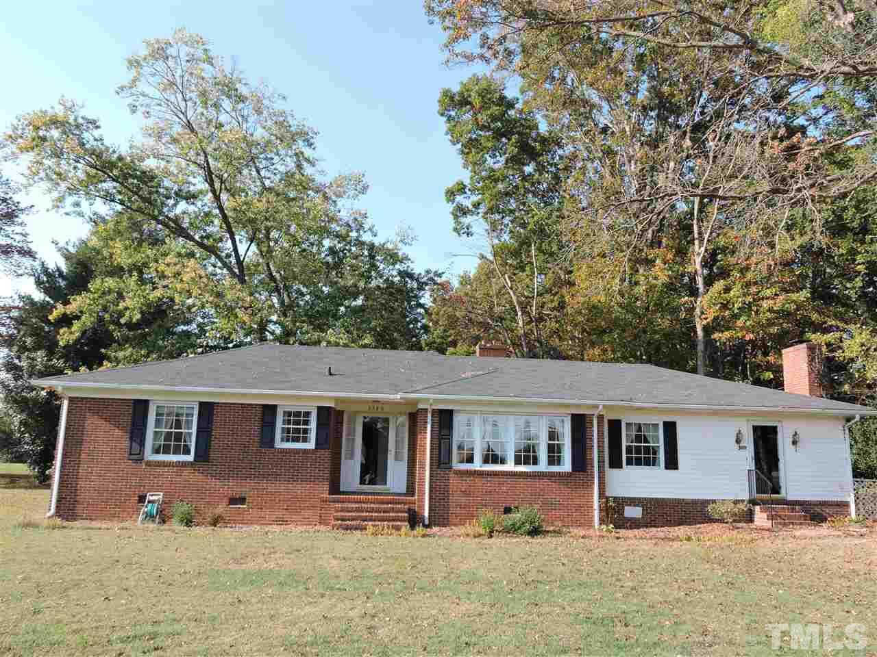 2580 Burlington Road Roxboro, NC 27574 - Photo 1 of 18 front view of a house with yard