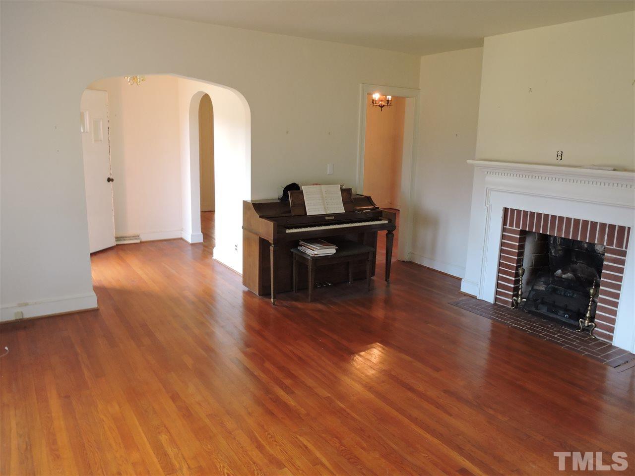 2580 Burlington Road Roxboro, NC 27574 - Photo 2 of 18 a living room with furniture and a fireplace