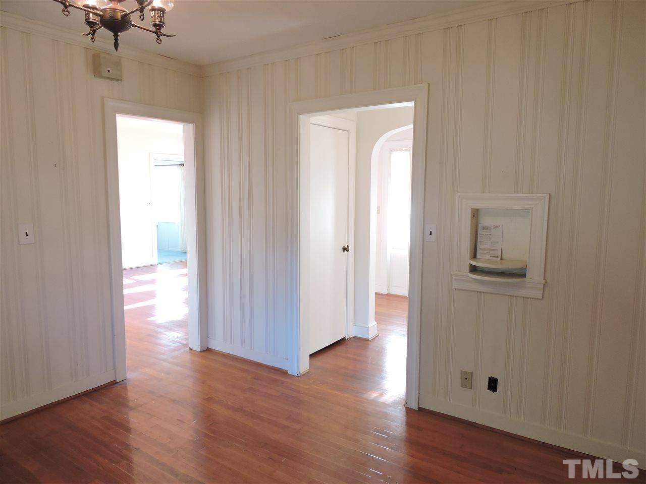 2580 Burlington Road Roxboro, NC 27574 - Photo 7 of 18 a view of a hallway with wooden floor