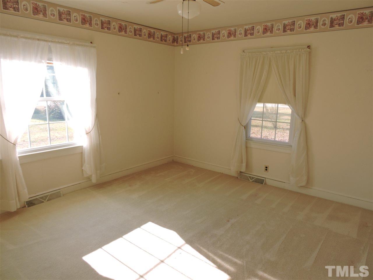 2580 Burlington Road Roxboro, NC 27574 - Photo 9 of 18 a view of a window in an empty room