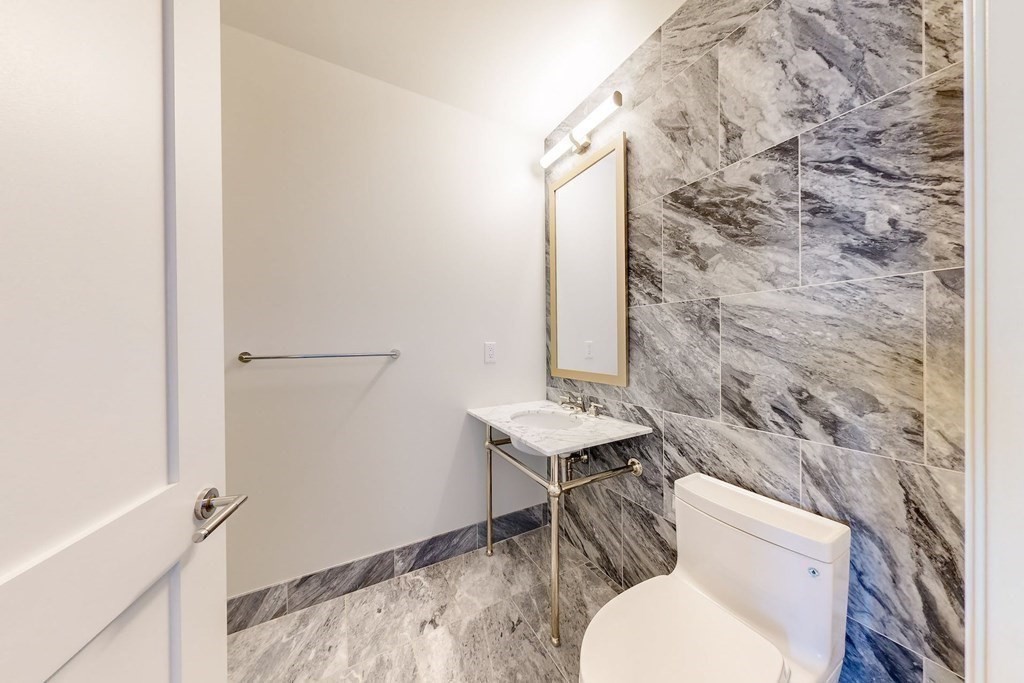 240 Devonshire Street, Unit 5206 Boston, MA 02110 - Photo 7 of 40 a bathroom with a toilet a sink and a shower