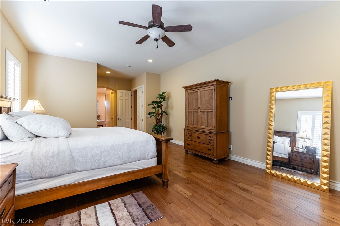 3661 Riley Ann Avenue Las Vegas, NV 89139 - Photo 30 of 42 Hardwood floors and a gentle ceiling fan create a comfortable atmosphere for rest.