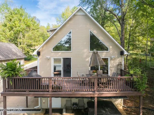 a view of a chair and table in the balcony