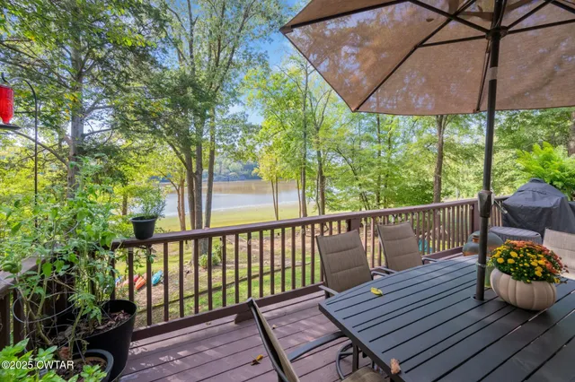 a view of a wooden deck with furniture