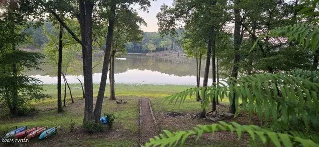 a view of a lake with a yard