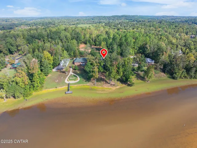 an aerial view of a houses and mountain view
