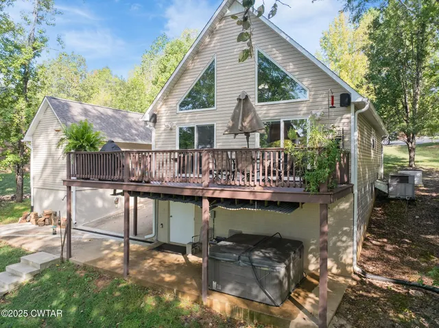a balcony with table and chairs
