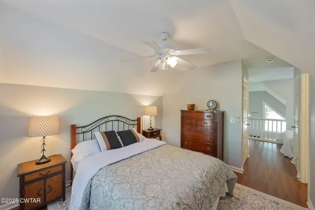 a bedroom with a bed and a mirror