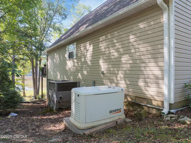 a view of house and backyard with furniture