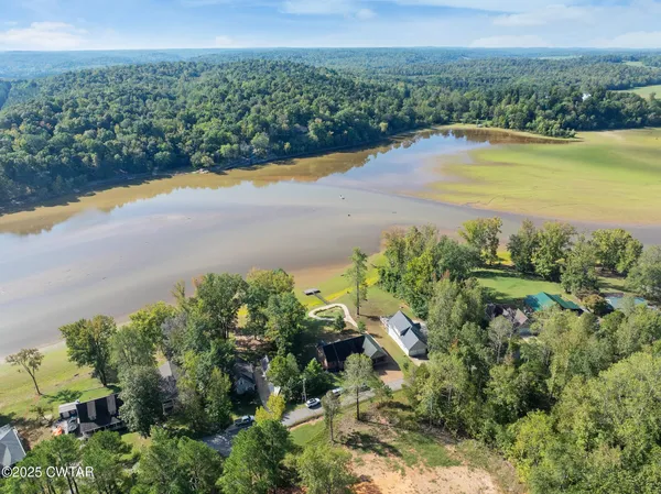 a view of a lake with big yard