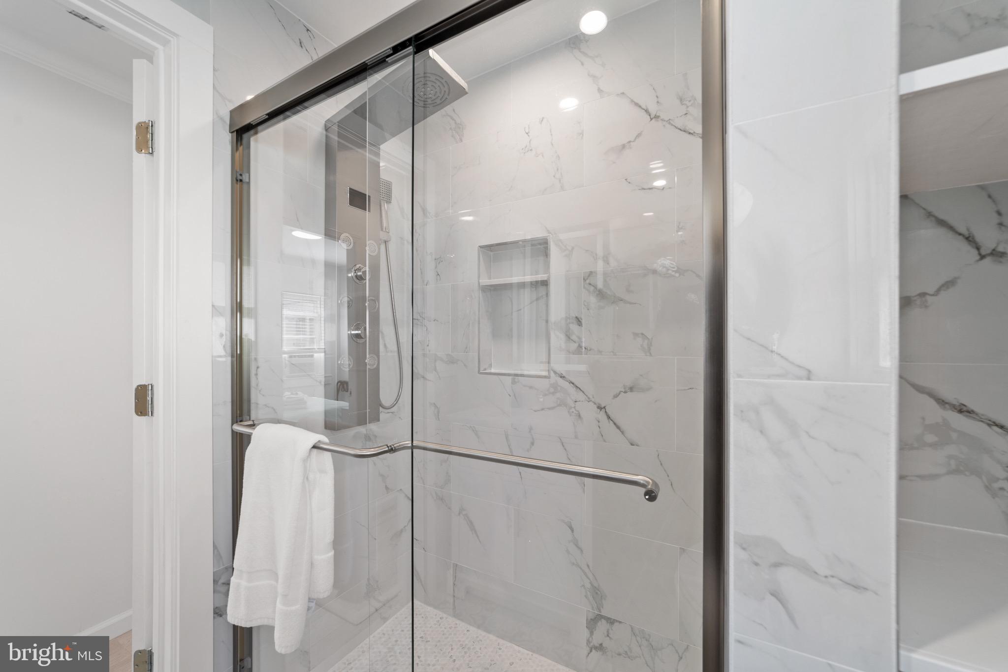 140 North Ocean Avenue Point Pleasant Beach, NJ 08742 - Photo 15 of 49 a bathroom with a glass shower door and a shower