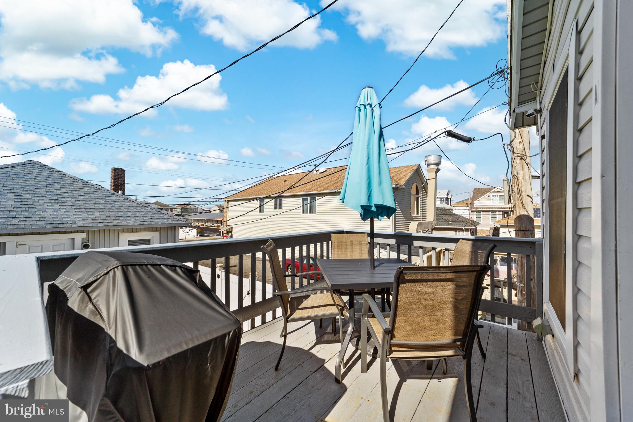 140 North Ocean Avenue Point Pleasant Beach, NJ 08742 - Photo 18 of 49 a view of balcony with wooden floor and outdoor seating