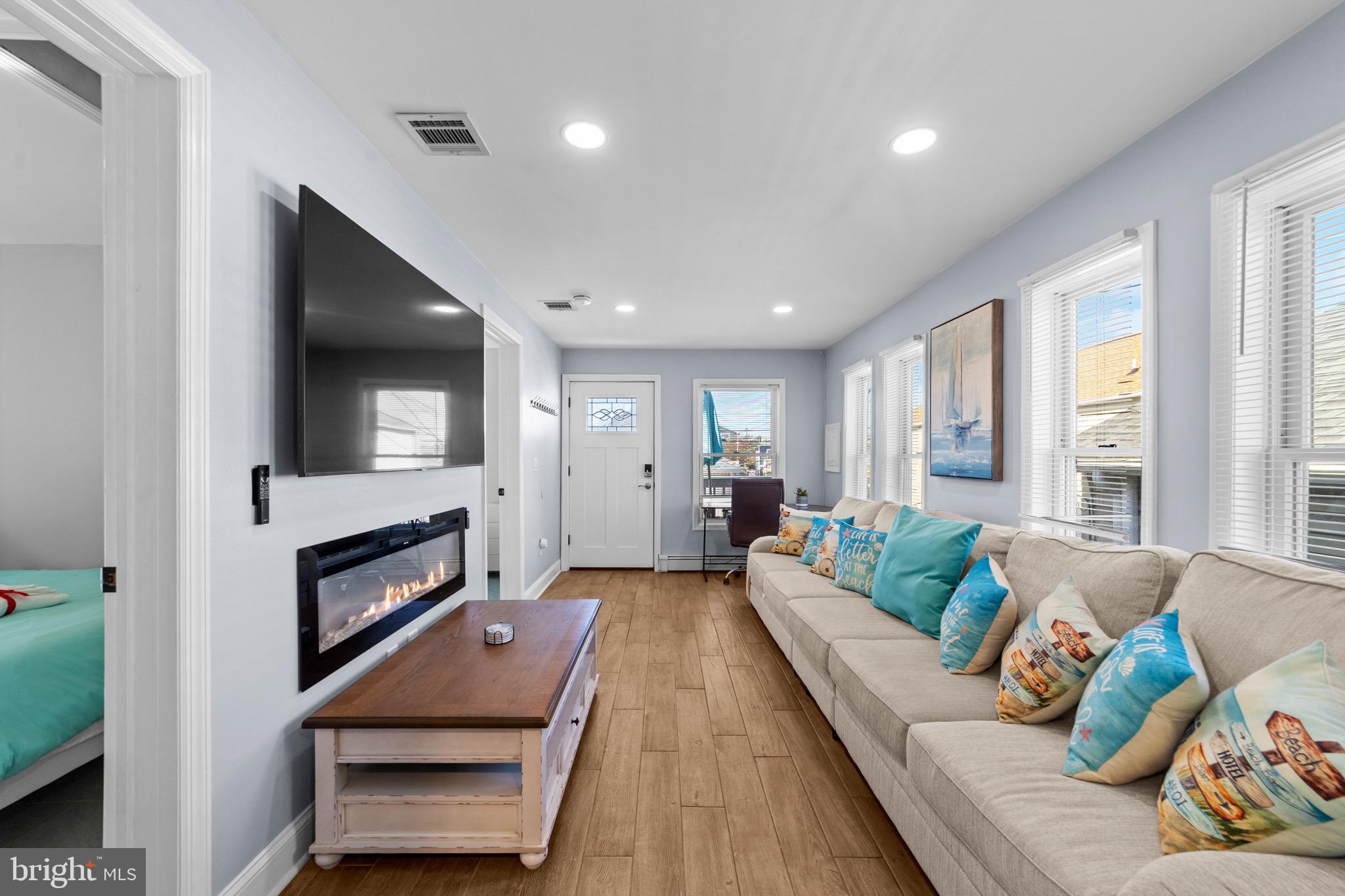 140 North Ocean Avenue Point Pleasant Beach, NJ 08742 - Photo 19 of 49 a living room with furniture and a fireplace