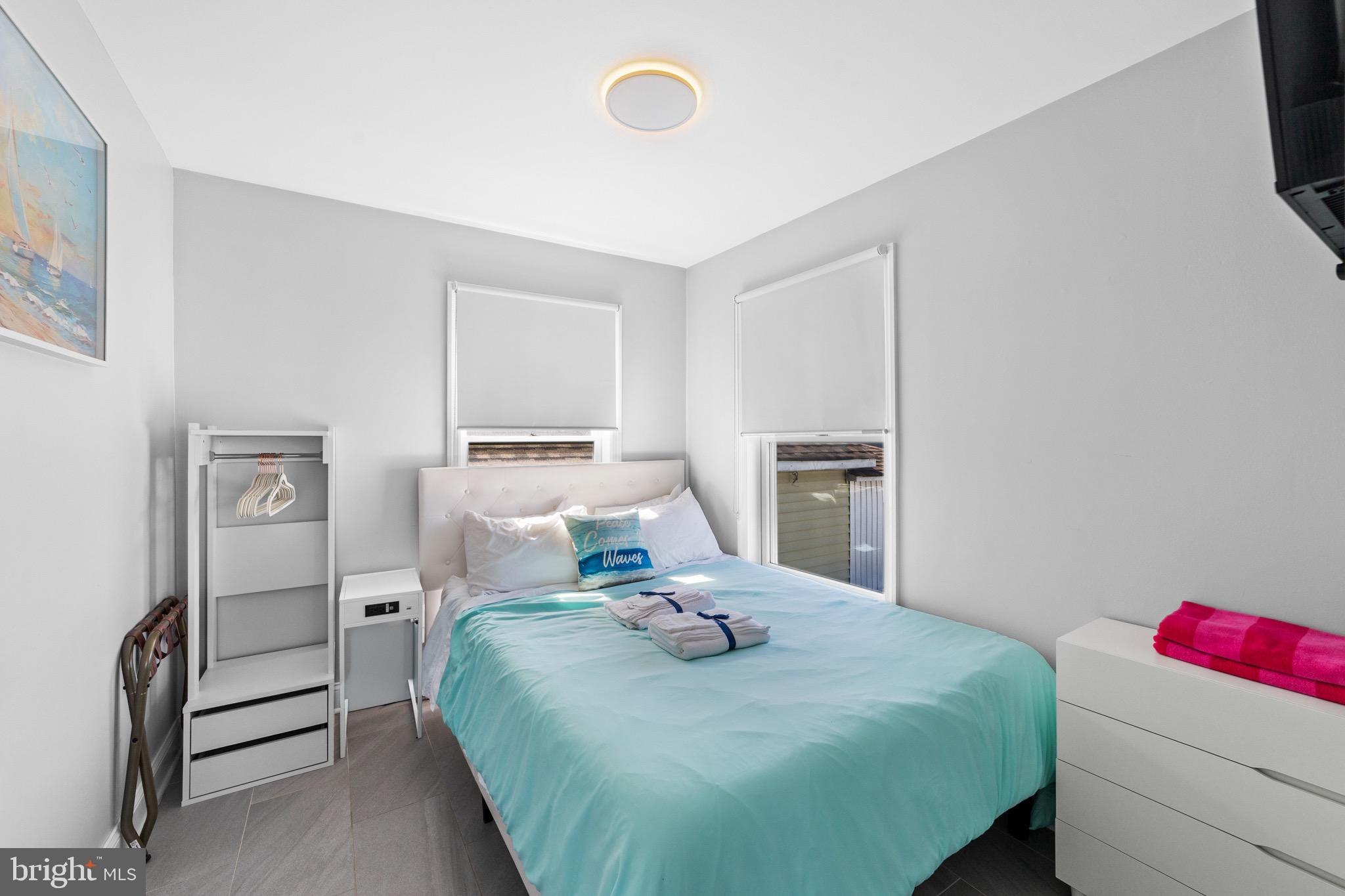 140 North Ocean Avenue Point Pleasant Beach, NJ 08742 - Photo 26 of 49 a bedroom with a bed and a cabinets