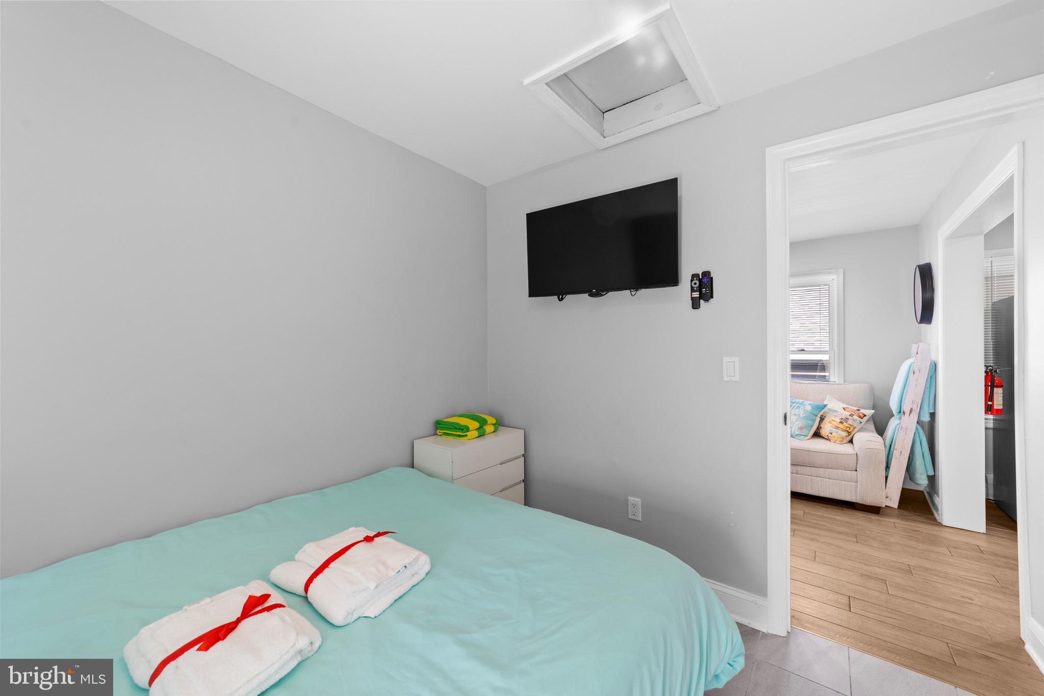 140 North Ocean Avenue Point Pleasant Beach, NJ 08742 - Photo 28 of 49 a bedroom with a bed a flat screen tv and dresser