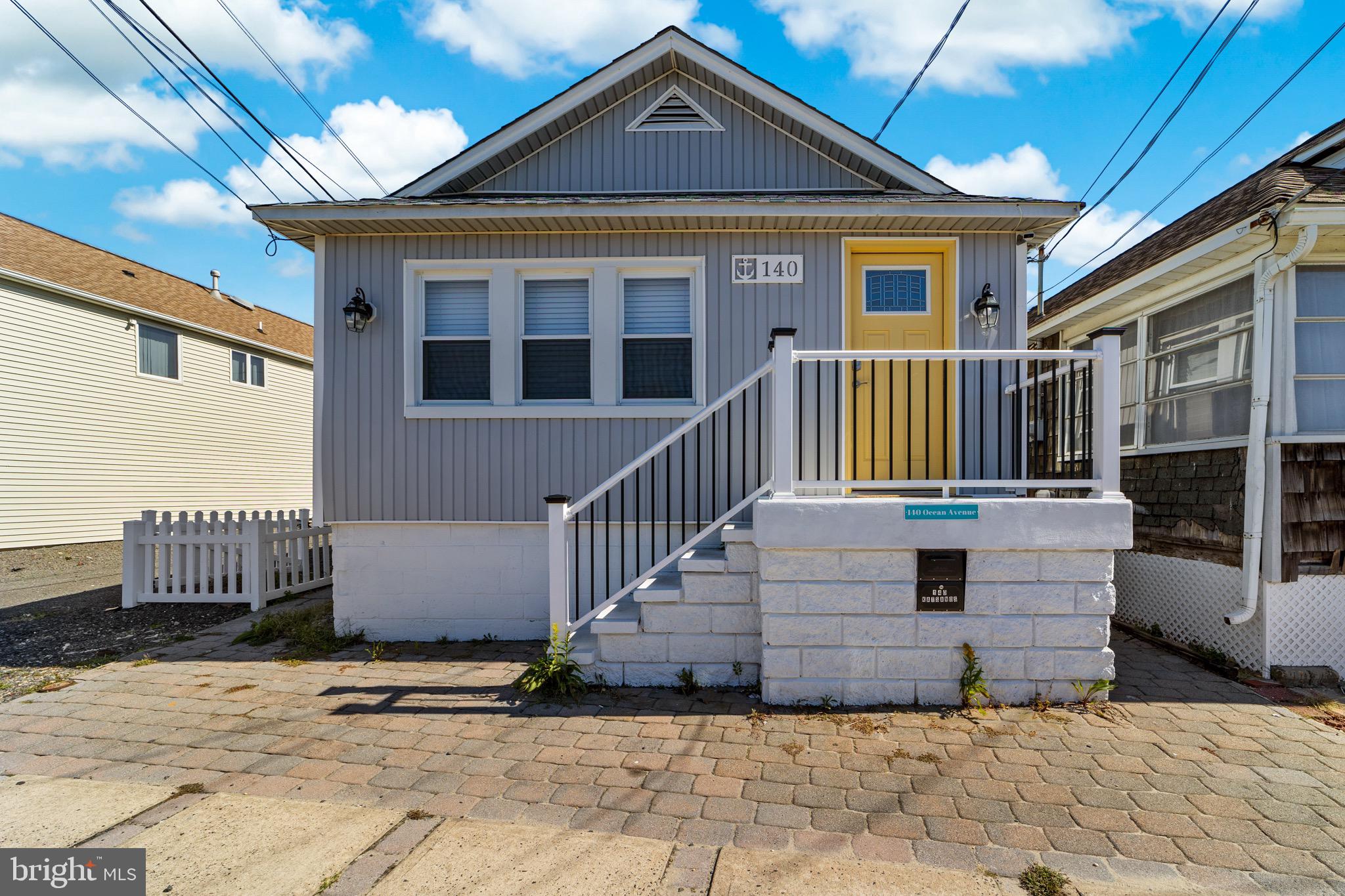 140 North Ocean Avenue Point Pleasant Beach, NJ 08742 - Photo 3 of 49 a front view of a house with a yard