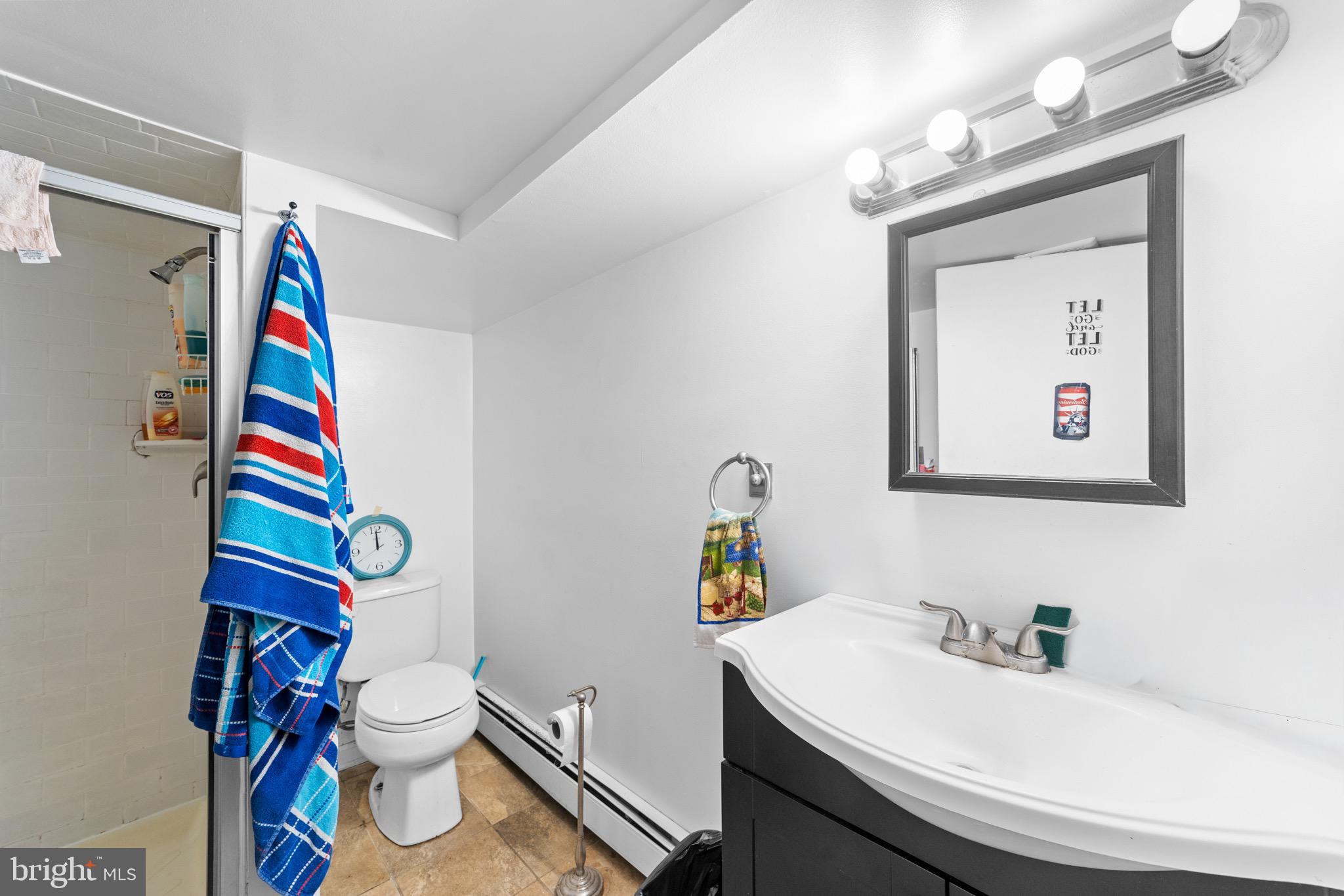 140 North Ocean Avenue Point Pleasant Beach, NJ 08742 - Photo 35 of 49 a bathroom with a sink mirror vanity and toilet