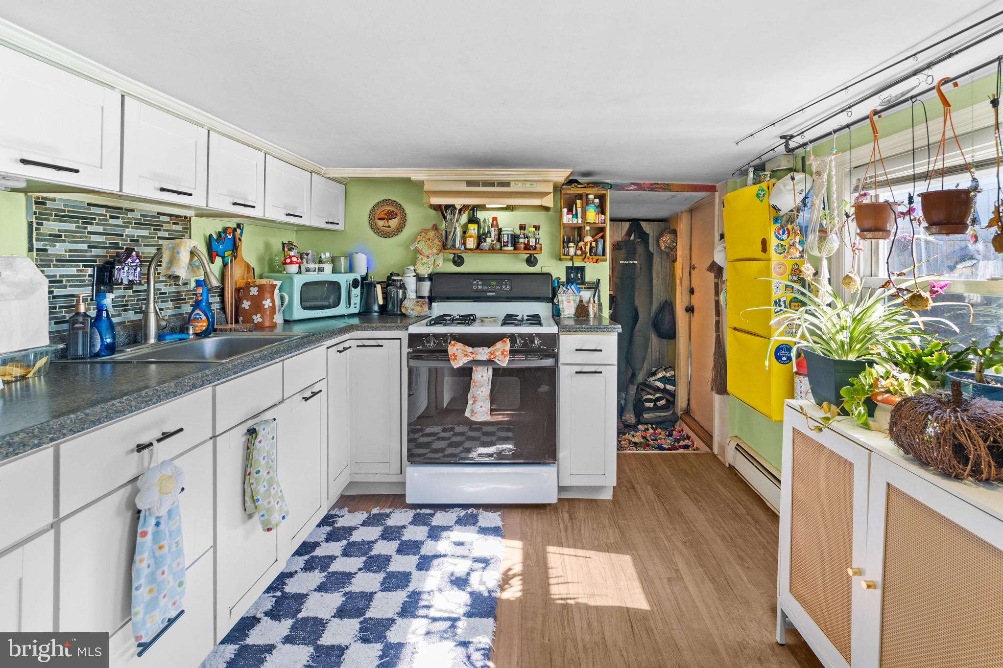 140 North Ocean Avenue Point Pleasant Beach, NJ 08742 - Photo 36 of 49 a kitchen with stainless steel appliances granite countertop a stove a sink and a refrigerator