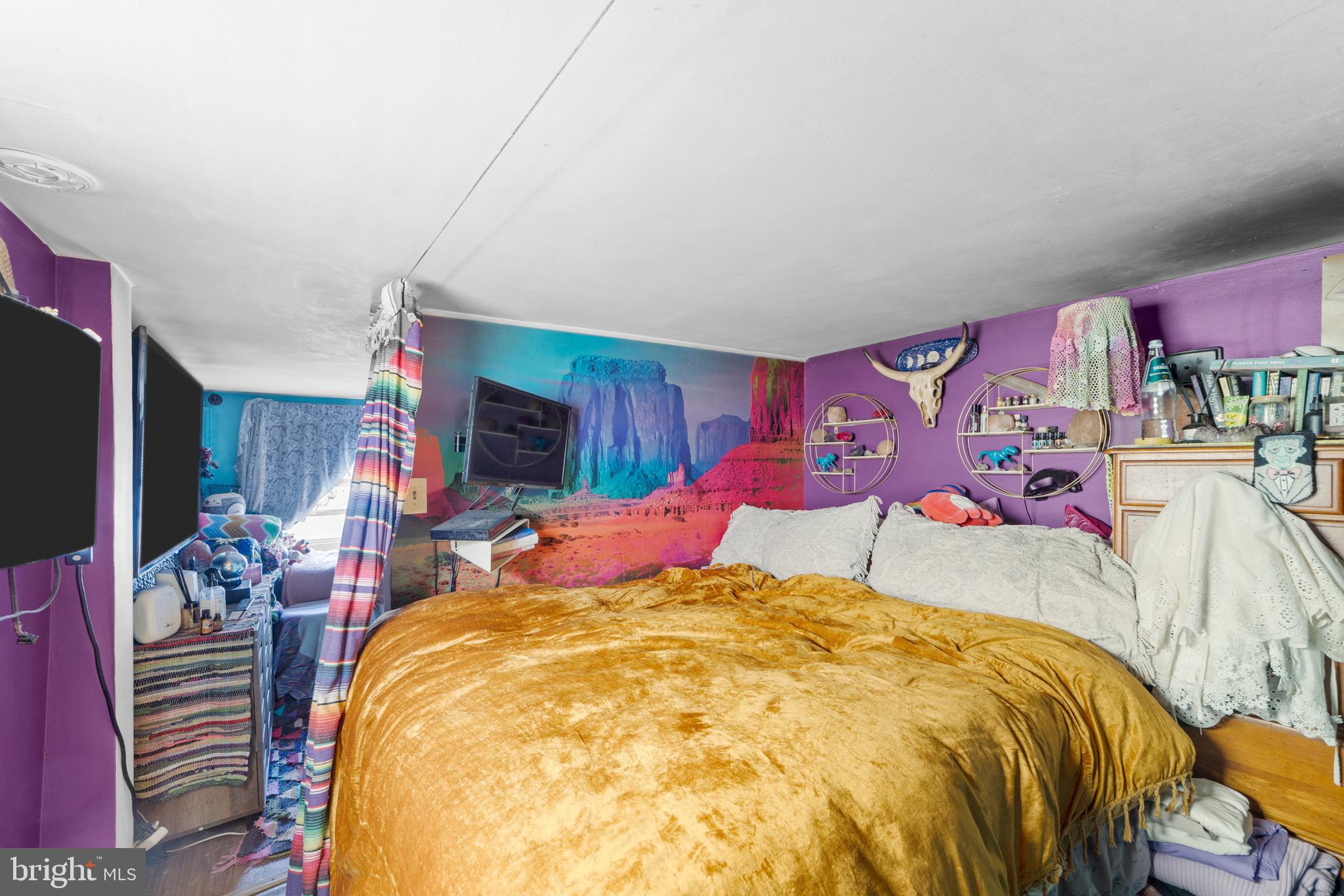 140 North Ocean Avenue Point Pleasant Beach, NJ 08742 - Photo 39 of 49 a bed sitting in a bedroom next to a lamp