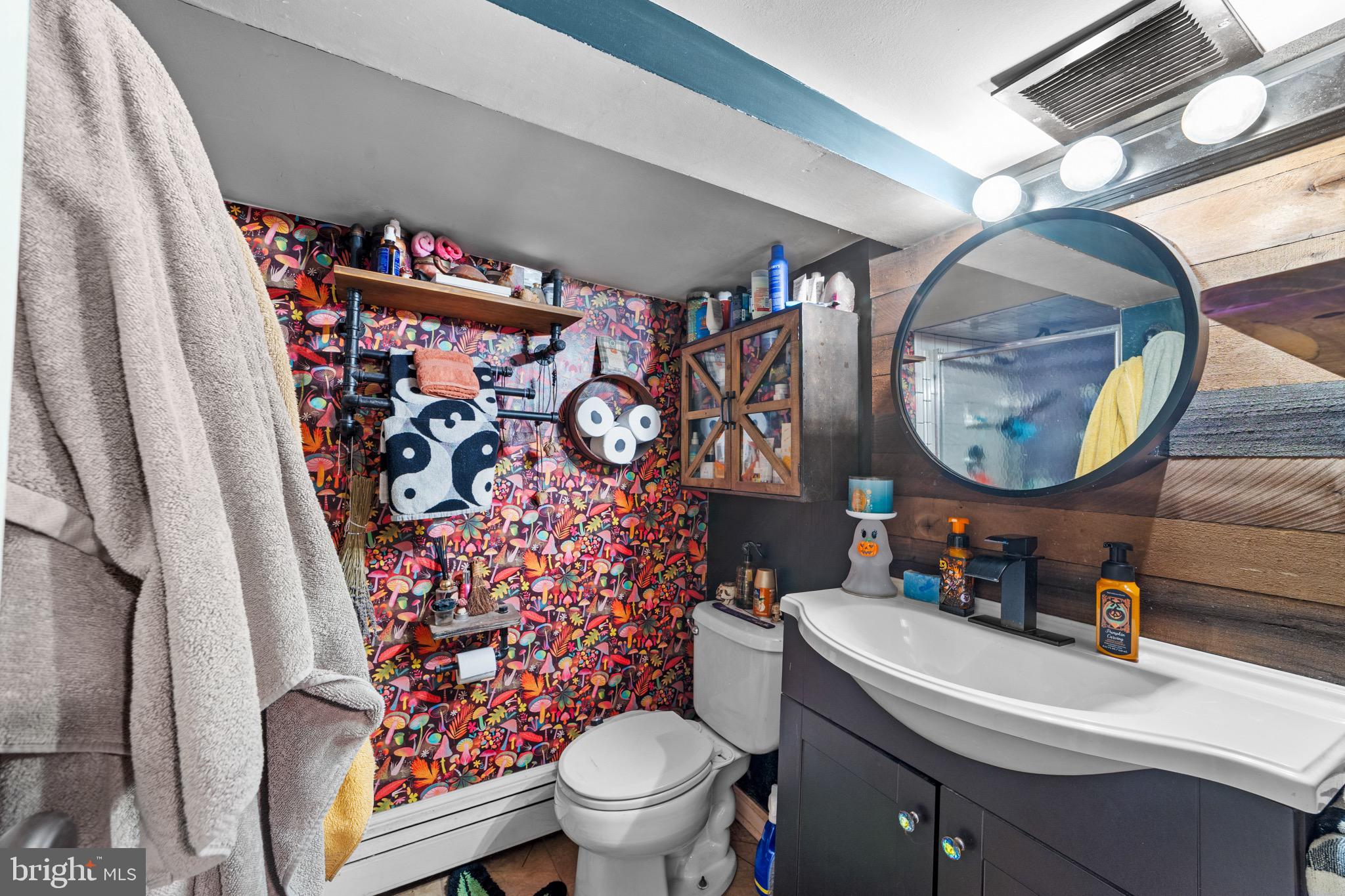 140 North Ocean Avenue Point Pleasant Beach, NJ 08742 - Photo 40 of 49 a bathroom with a toilet sink and mirror