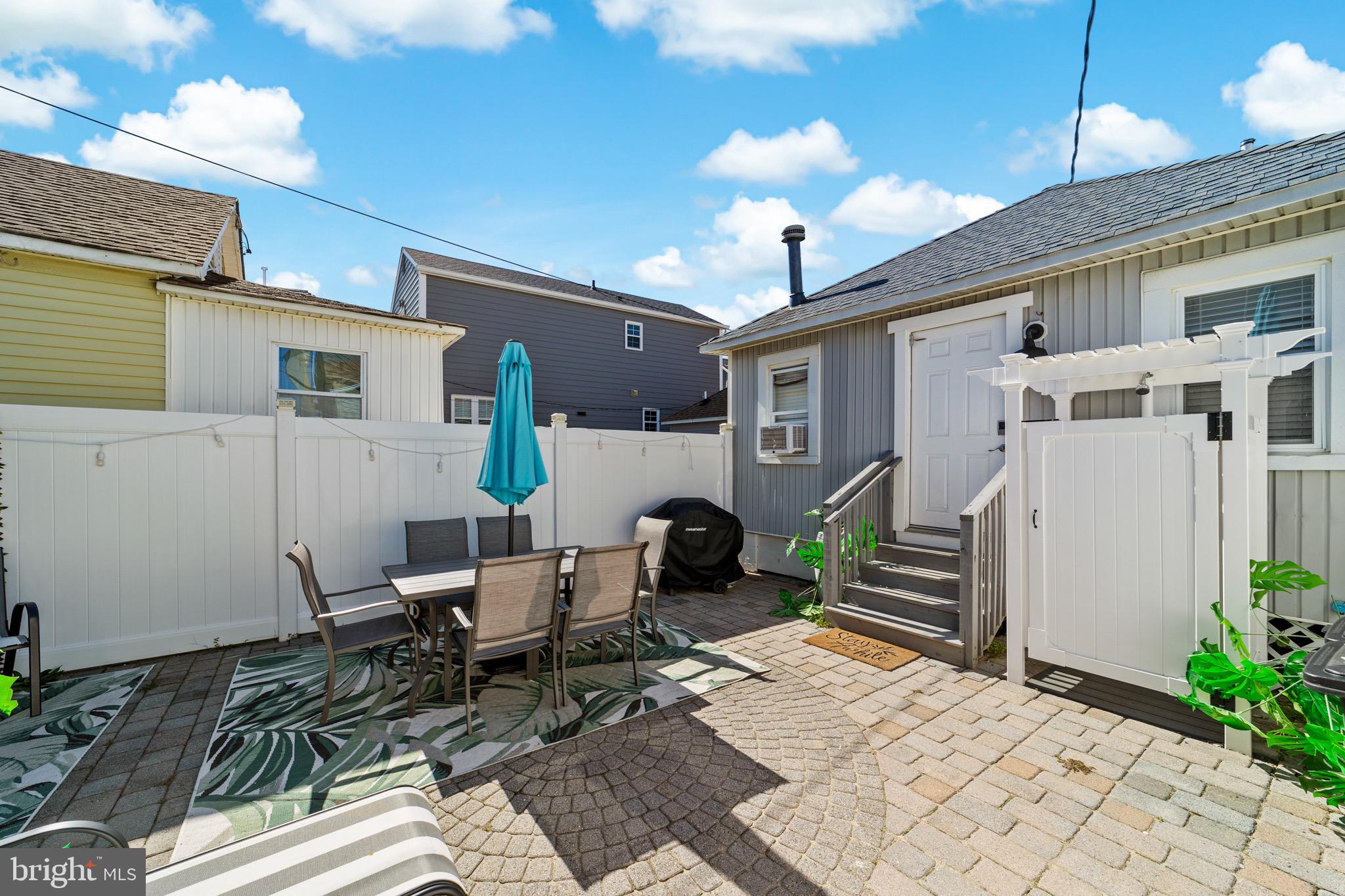 140 North Ocean Avenue Point Pleasant Beach, NJ 08742 - Photo 42 of 49 a backyard of a house with outdoor seating
