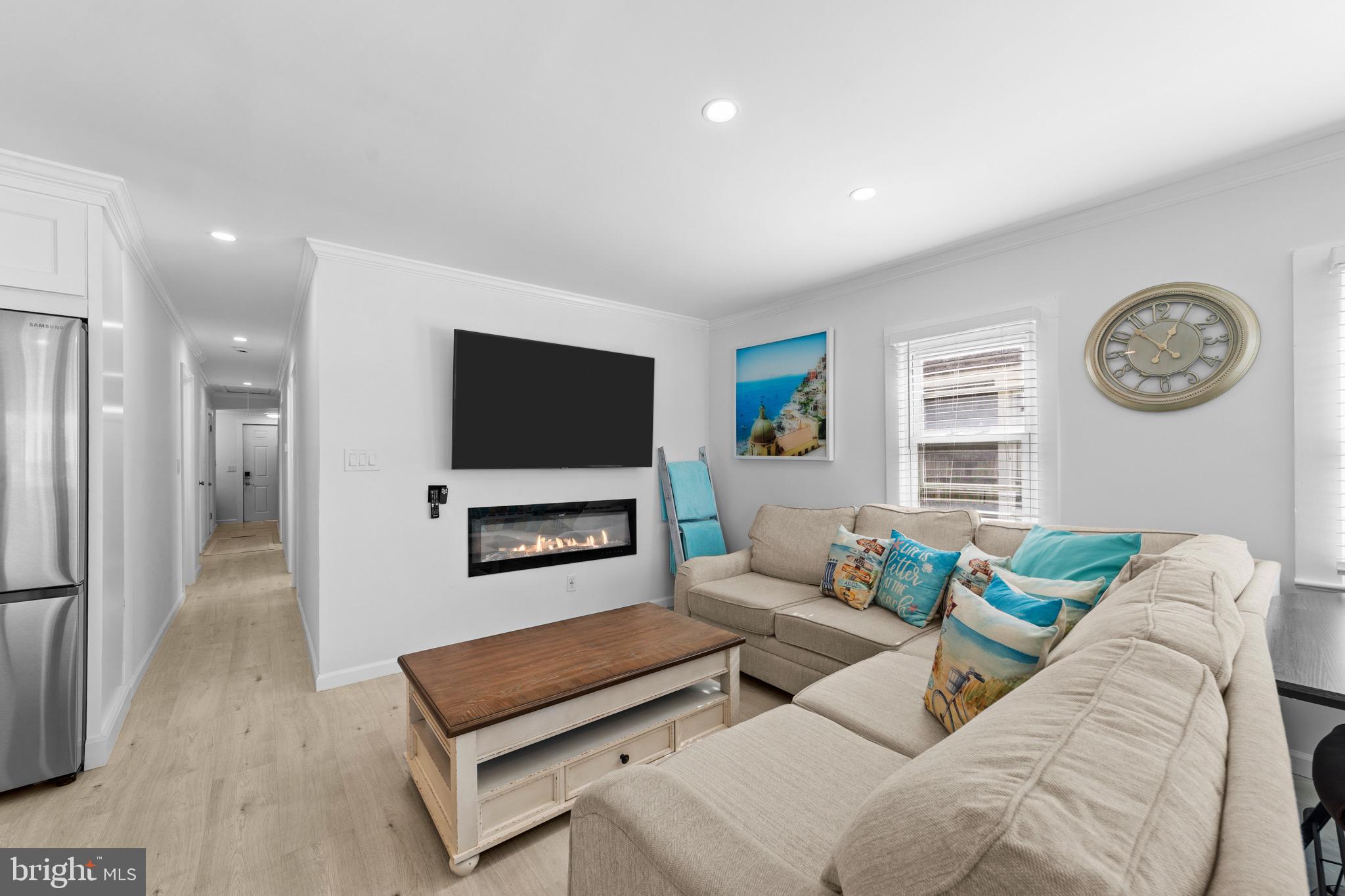 140 North Ocean Avenue Point Pleasant Beach, NJ 08742 - Photo 5 of 49 a living room with furniture and a flat screen tv