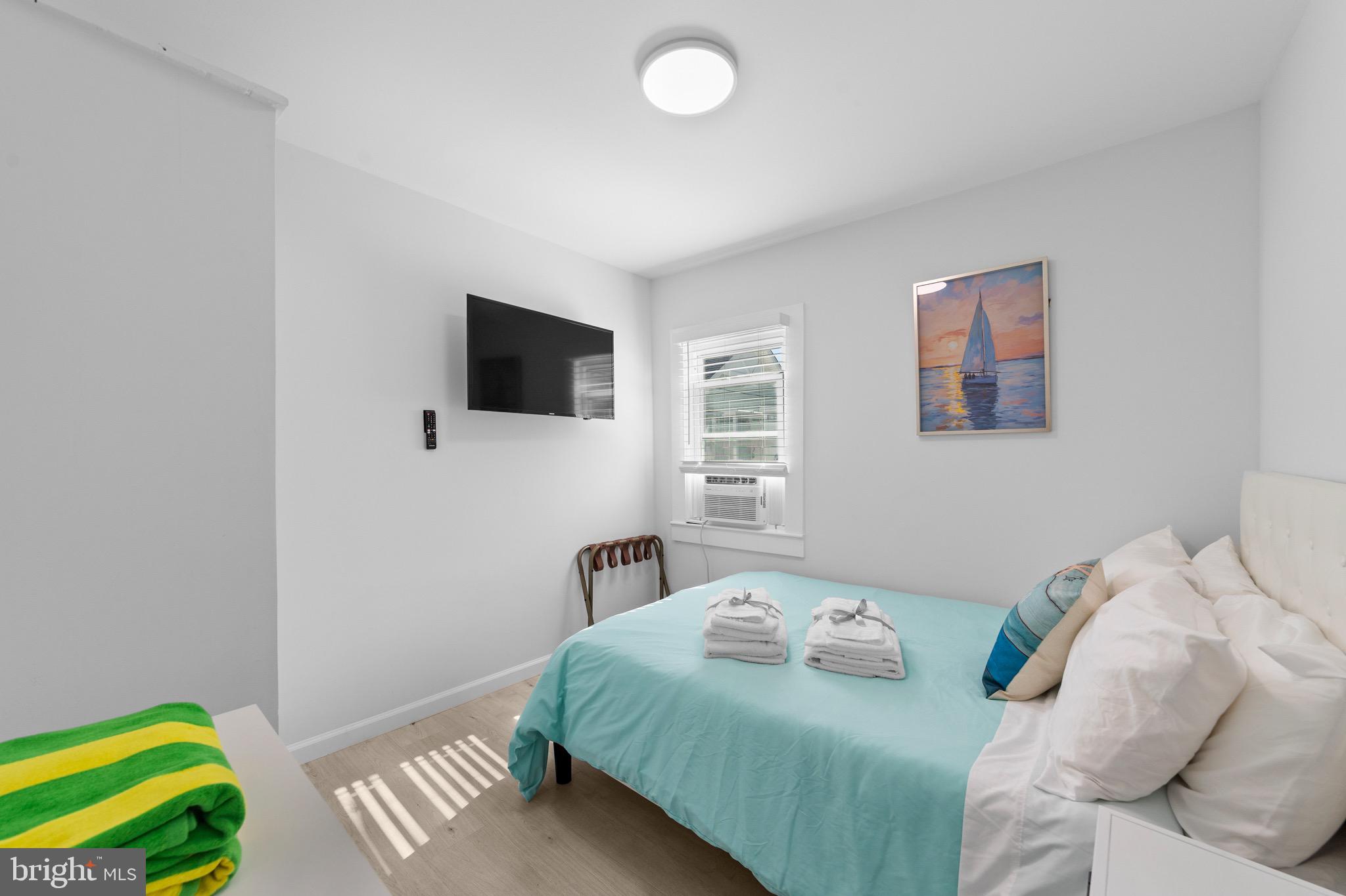 140 North Ocean Avenue Point Pleasant Beach, NJ 08742 - Photo 8 of 49 a bedroom with a bed and a window