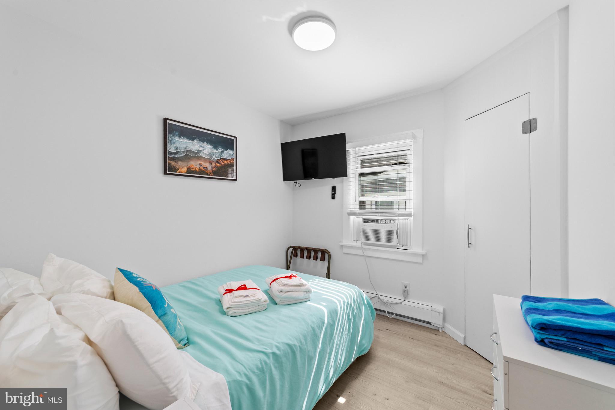 140 North Ocean Avenue Point Pleasant Beach, NJ 08742 - Photo 10 of 49 a bedroom with a bed and a window