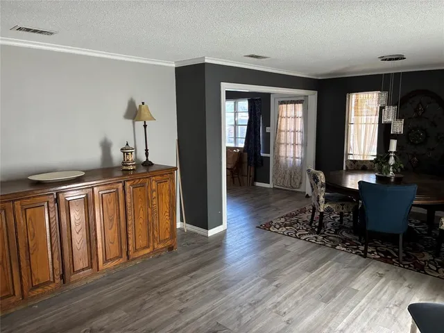 a bedroom with a bed and a mirror