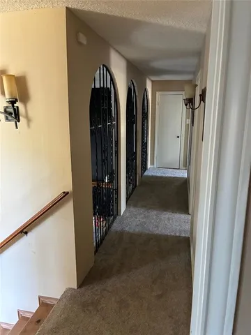 a view of a livingroom with furniture hardwood floor and a window