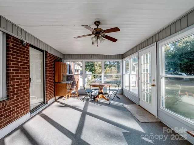 a view of a house with a yard and porch