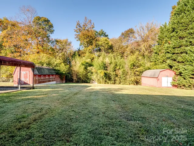 a view of a backyard with a garden and entertaining space