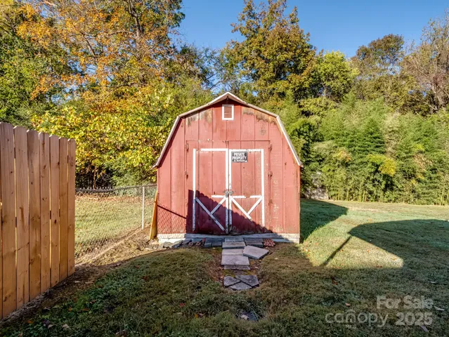 a view of a backyard with potted plants