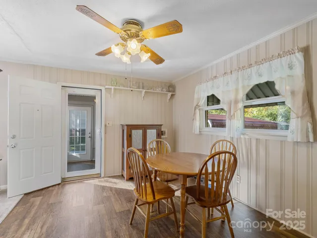 a kitchen with a sink cabinets stainless steel appliances and a window
