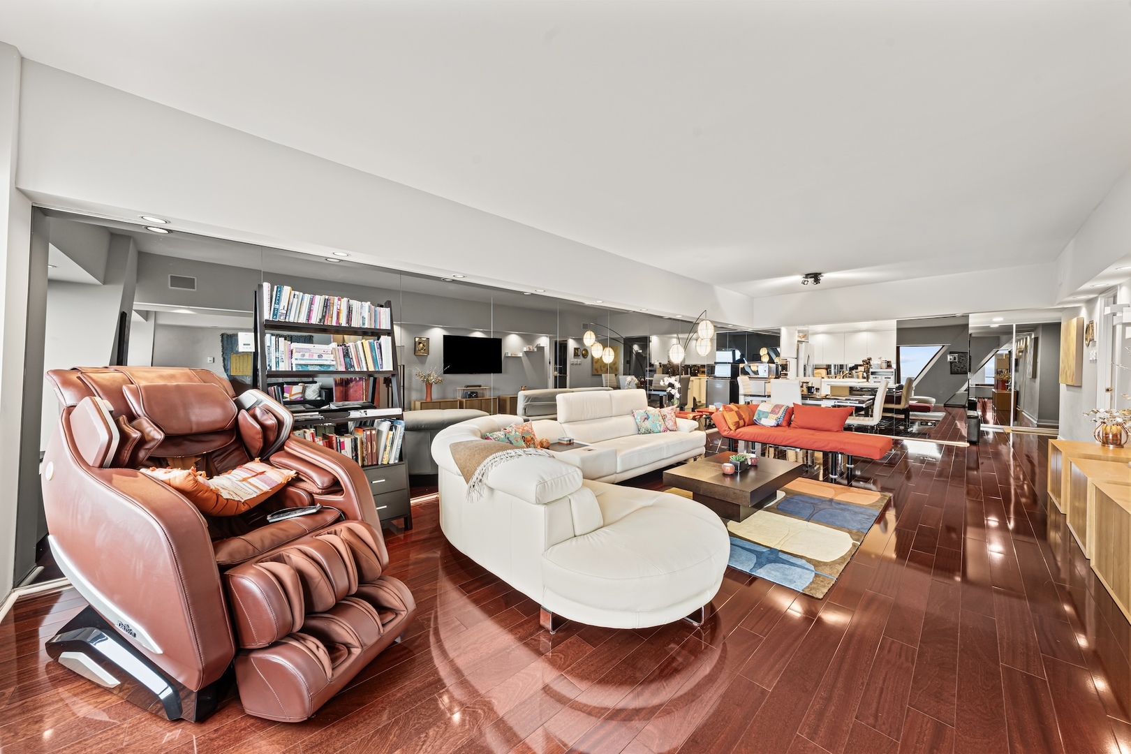 175 East Delaware Place, Unit 6706 Chicago, IL 60611 - Photo 3 of 26 a living room with furniture a rug and white walls