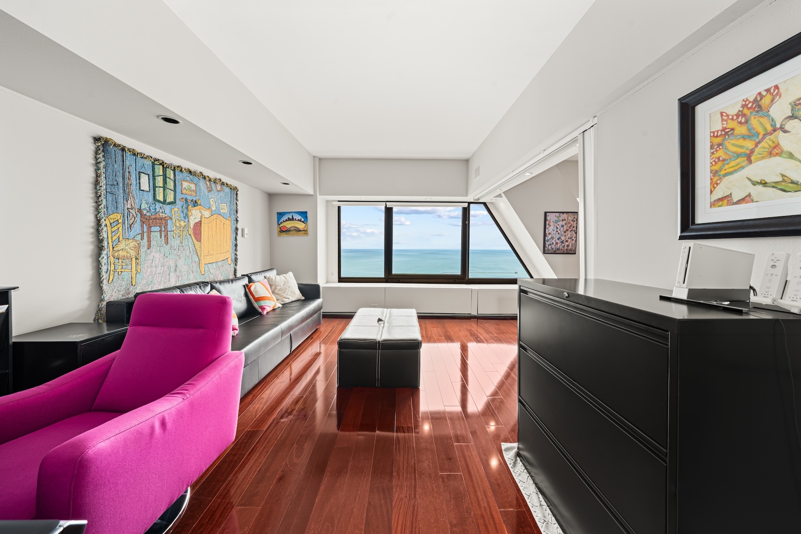 175 East Delaware Place, Unit 6706 Chicago, IL 60611 - Photo 7 of 26 a living room with furniture and a floor to ceiling window