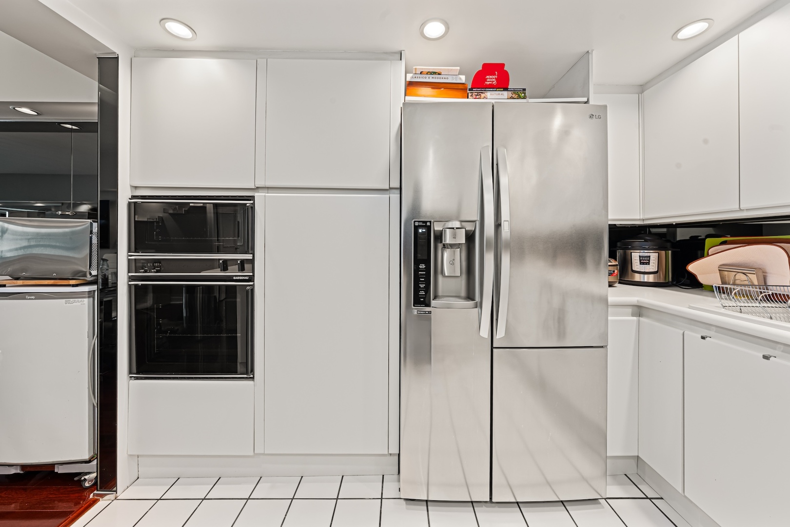 175 East Delaware Place, Unit 6706 Chicago, IL 60611 - Photo 10 of 26 a kitchen with granite countertop a refrigerator and a sink