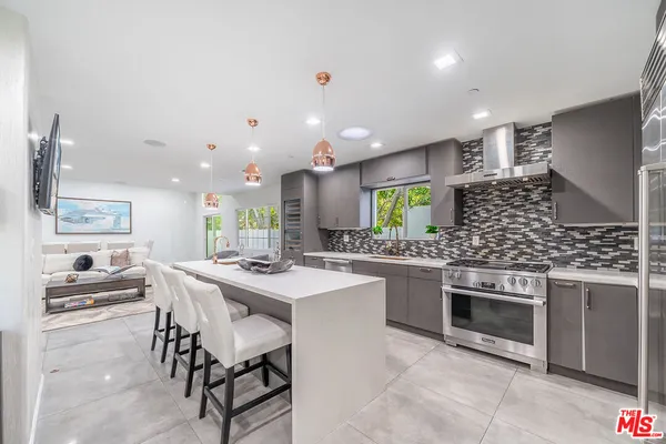 a living room with furniture window and wooden floor