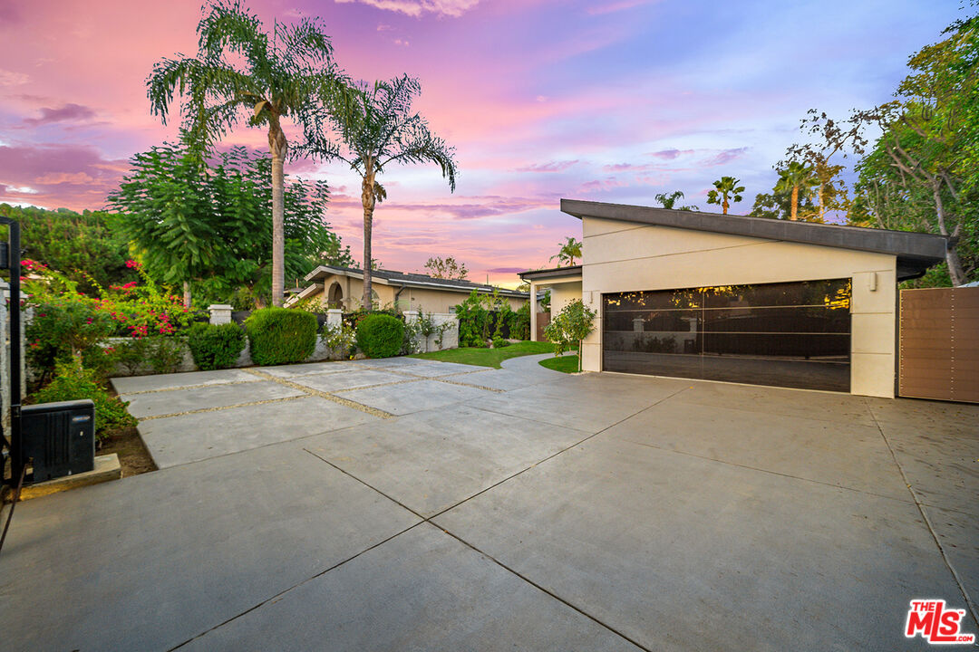 5010 Fulton Avenue Sherman Oaks, CA 91423 - Photo 2 of 55 a front view of a house with a yard and garage