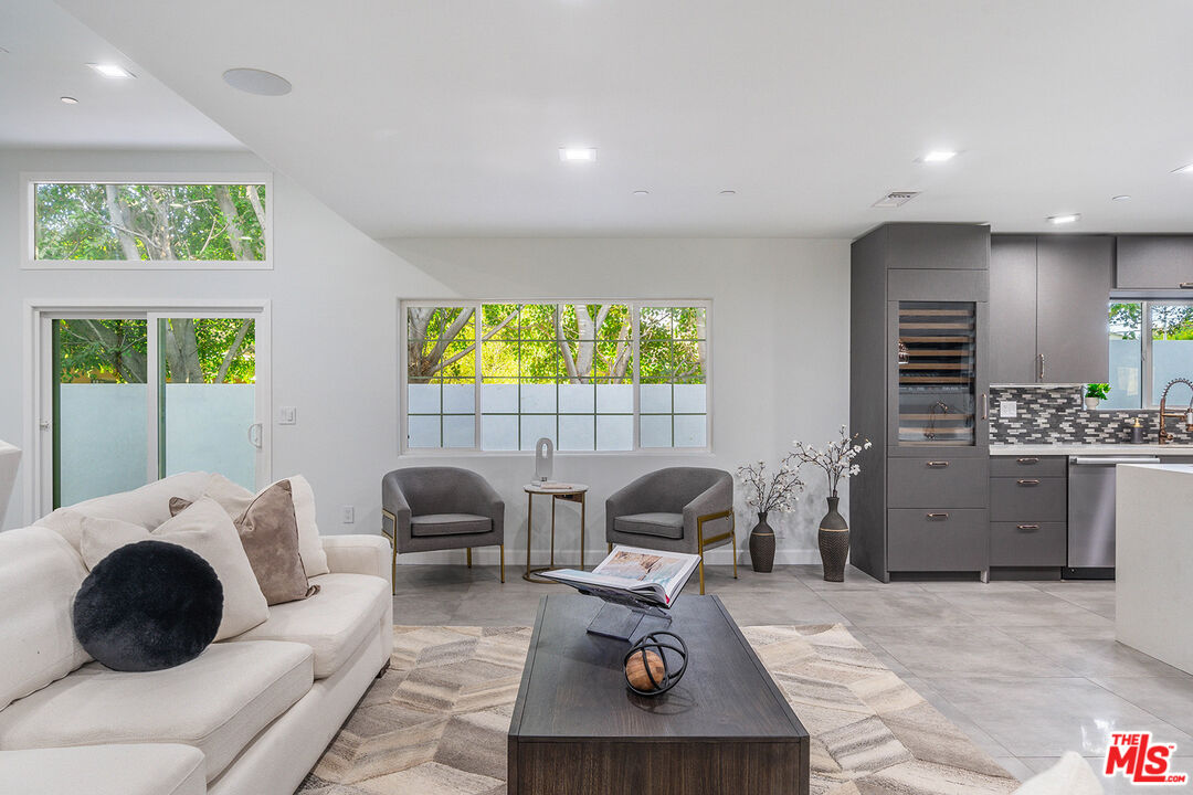 5010 Fulton Avenue Sherman Oaks, CA 91423 - Photo 23 of 55 a bedroom with a bed and a chair