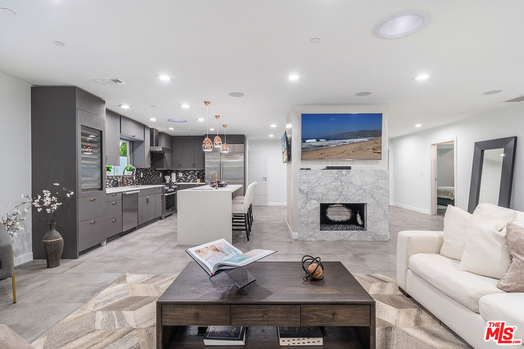5010 Fulton Avenue Sherman Oaks, CA 91423 - Photo 24 of 55 a living room with furniture and a fireplace