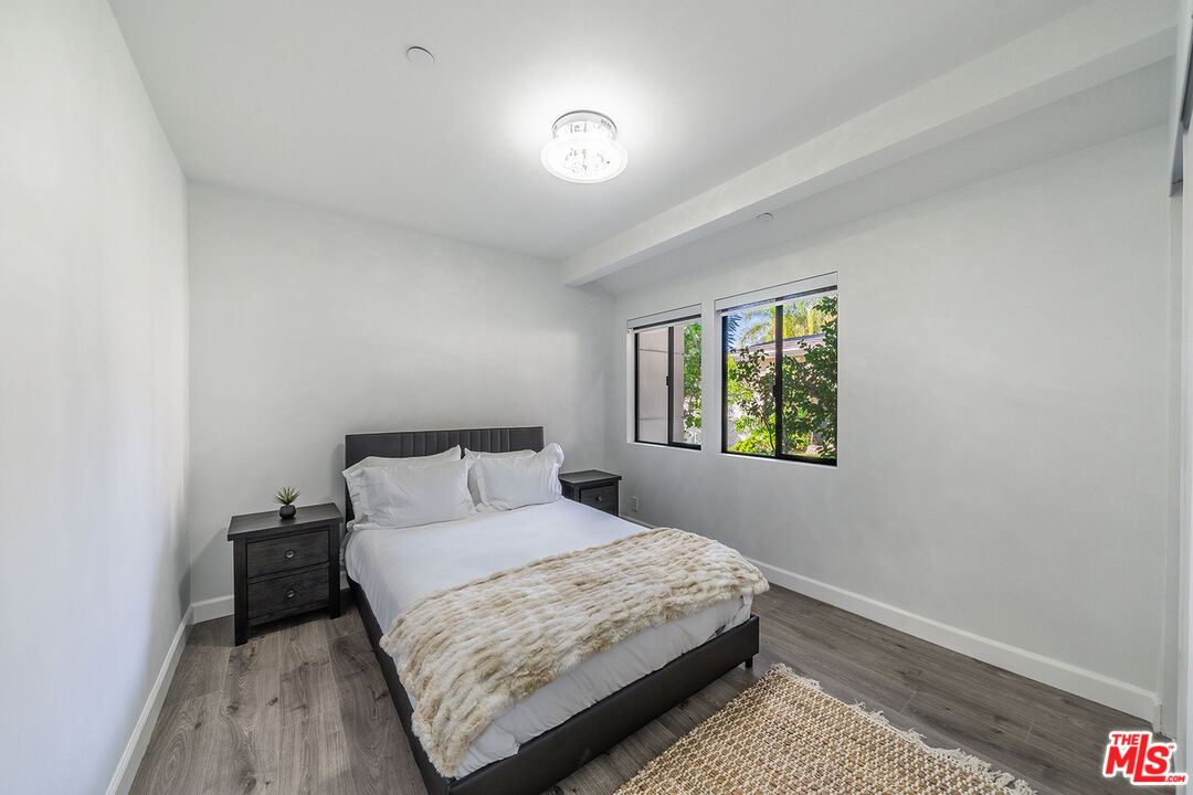 5010 Fulton Avenue Sherman Oaks, CA 91423 - Photo 26 of 55 a bedroom with a bed and a window