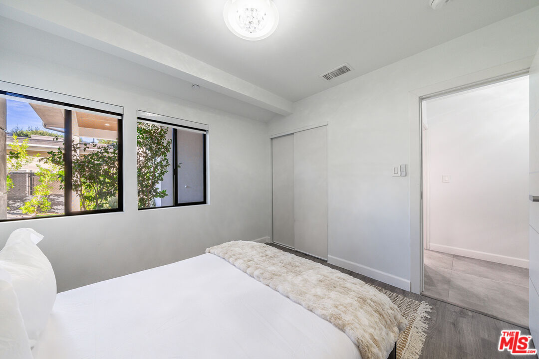 5010 Fulton Avenue Sherman Oaks, CA 91423 - Photo 27 of 55 a bedroom with a bed and a window