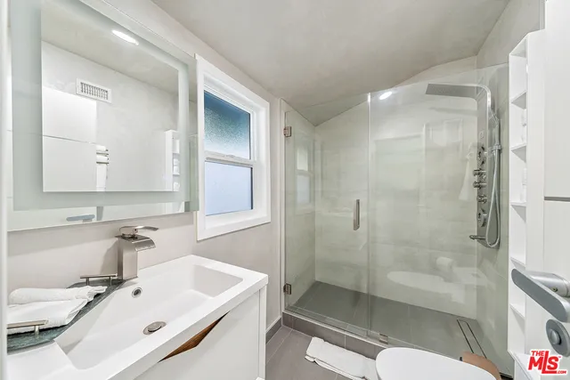 a spacious bedroom with a bed and furniture