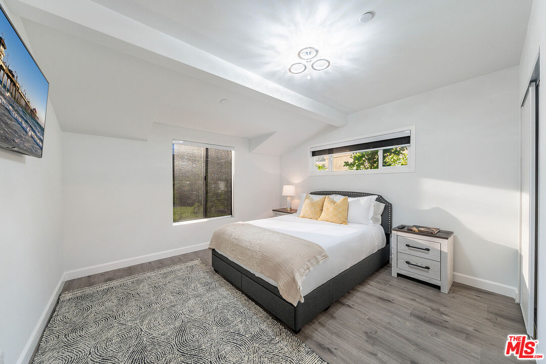 5010 Fulton Avenue Sherman Oaks, CA 91423 - Photo 29 of 55 a bedroom with a bed and a window