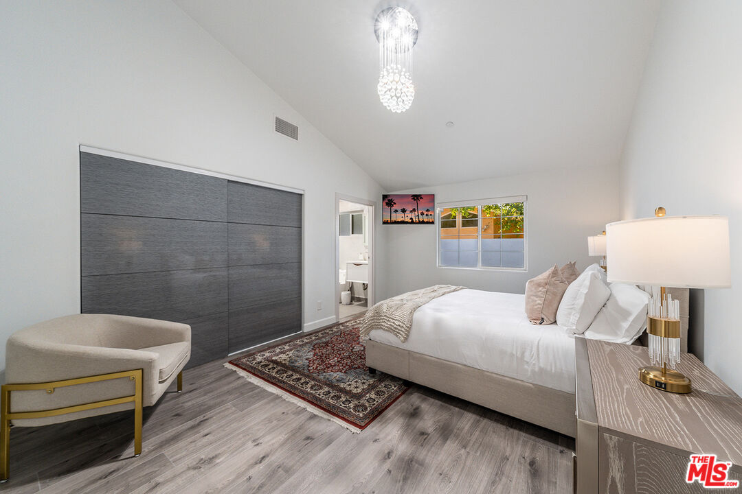 5010 Fulton Avenue Sherman Oaks, CA 91423 - Photo 35 of 55 a bedroom with a bed and a chair