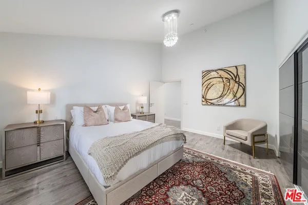 a bedroom with a bed and a couch