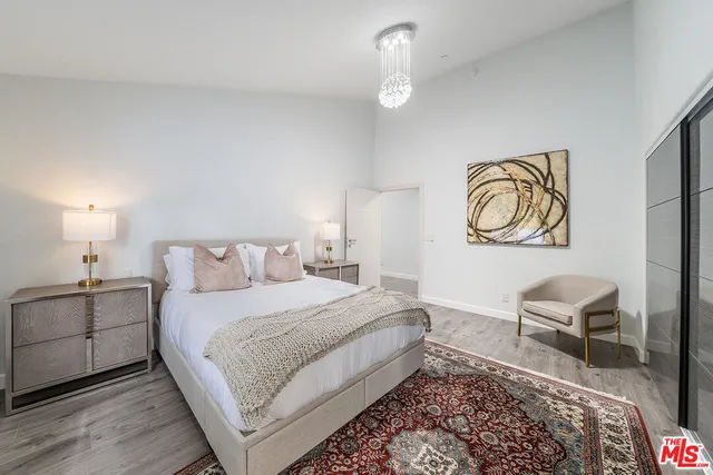 a bedroom with a bed and a couch