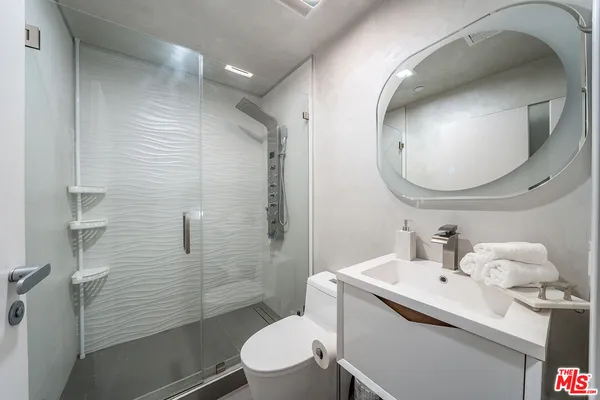a bathroom with a bathtub and shower